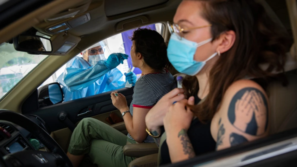 COVID-19 tests being administered at a drive-through complex in Jerusalem, on July 20, 2021. Photo by Olivier Fitoussi/Flash90.
