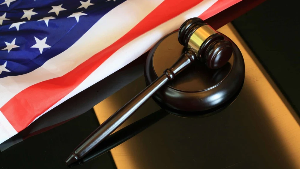 Gavel next to American flag. Credit: Sergei Tokmakov/Pixabay.