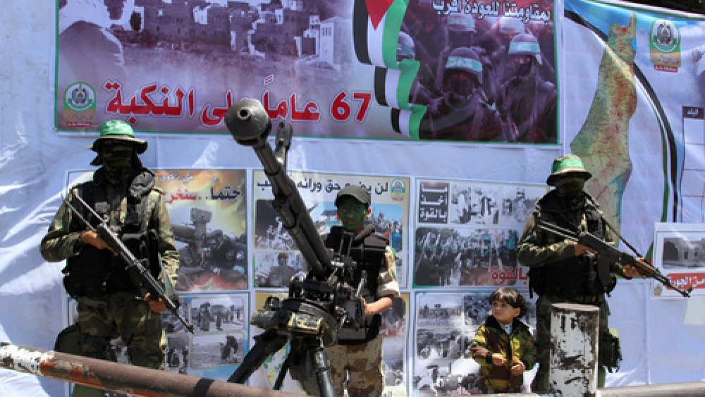 Hamas terrorists participate in a militaristic rally against Israel in the southern Gaza Strip on May 17, 2015. With the emergence of Islamic State supporters in Gaza, Hamas has a new rival in the territory in governs. Credit: Abed Rahim Khatib/Flash90.