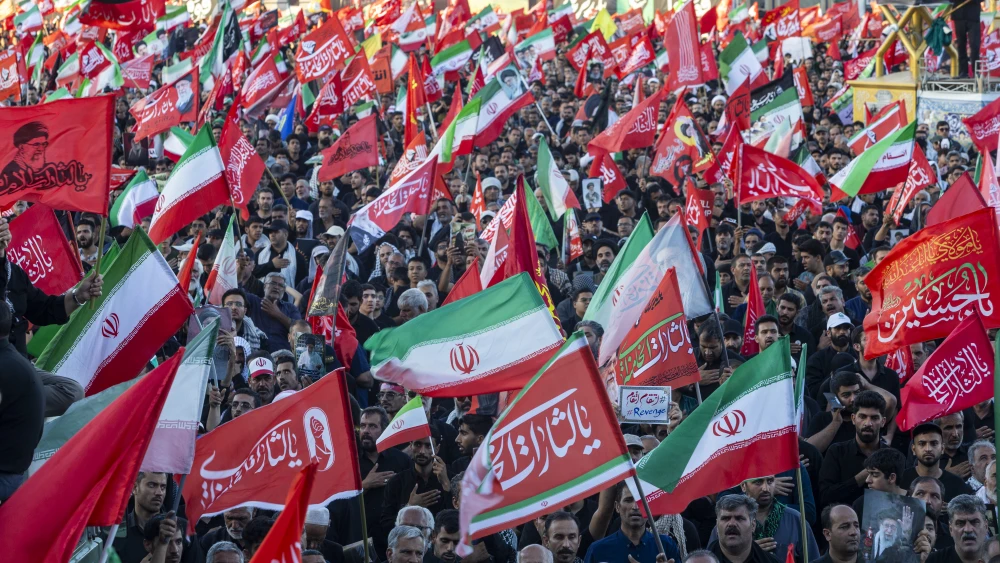 Crowds line the streets of Mashhad for the burial of slain Iranian Supreme Leader Ali Khamenei, July 9, 2026. Photo by Majid Saeedi/Getty Images.