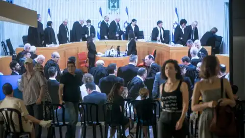 Israelis watch a live screening of a court hearing on petitions against the government's amendment to Basic Law: The Judiciary, at the Tel Aviv Museum of Art, Sept. 12, 2023. Photo by Miriam Alster/Flash90.
