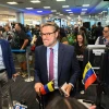 Venezuelan Representative to the U.S. Felix Plasencia boards an American Airlines flight to Caracas at Miami International Airport on April 30, 2026, marking the first direct flight between the two nations in seven years. Photo by Chandan Khanna/AFP via Getty Images.