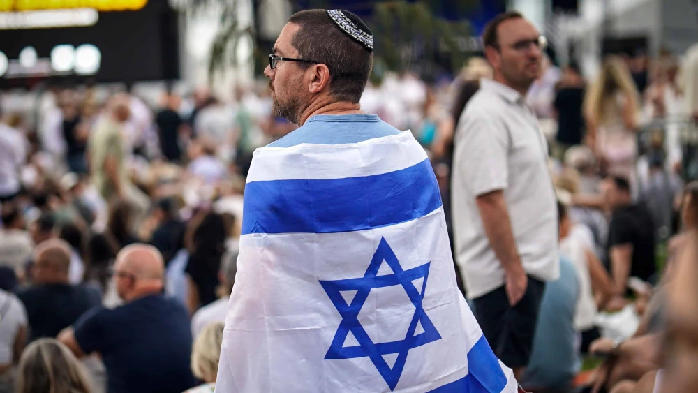 A man attends a memorial at the site of the Bondi Beach mass shooting in Sydney, Australia, Dec. 21, 2025. Photo by Audrey Richardson/Getty Images.