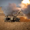 An IDF artillery unit fires into the Gaza Strip, Oct. 15, 2023. Photo by Oren Ben Hakoon/Flash90.
