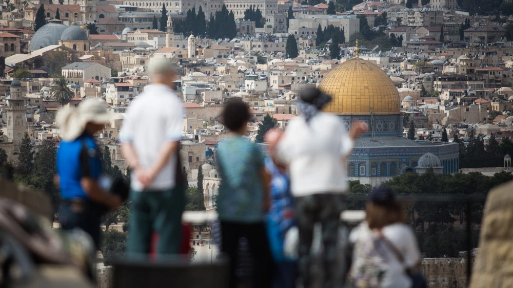 Tourists take in the view of the Dome of the Rock and Temple Mount from the Mount of Olives platform overlooking the Old City of Jerusalem, on Oct. 11, 2018. Photo by Hadas Parush/Flash90.