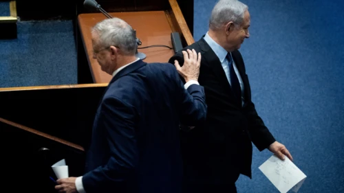 Blue and White Party leader Benny Gantz passes Israeli Prime Minister Benjamin Netanyahu at a memorial ceremony in the Knesset marking 24 years since the assassination of former Israeli Prime Minister Yitzhak Rabin, on Nov. 10, 2019. Photo by Yonatan Sindel/Flash90.