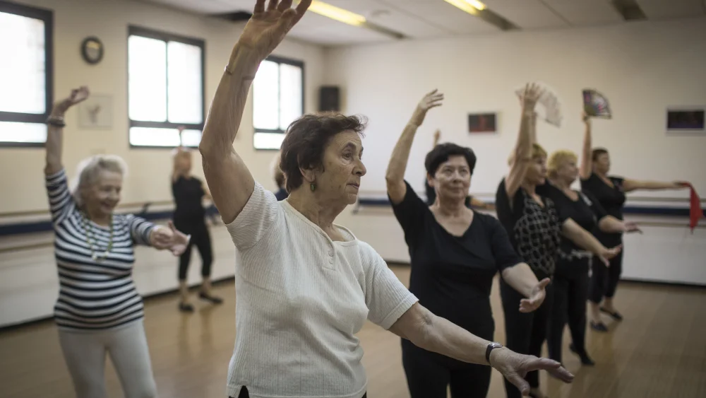 Elderly Russian women rehearse at a community center in Jerusalem’s Pisgat Ze’ev neighborhood, Sept. 17, 2014. The modern dance group, composed of women ages 60 to 90, is led by 90-year-old choreographer Genadi Korenevsky, a former USSR troupe dancer during World War II. Photo by Hadas Parush/Flash90.