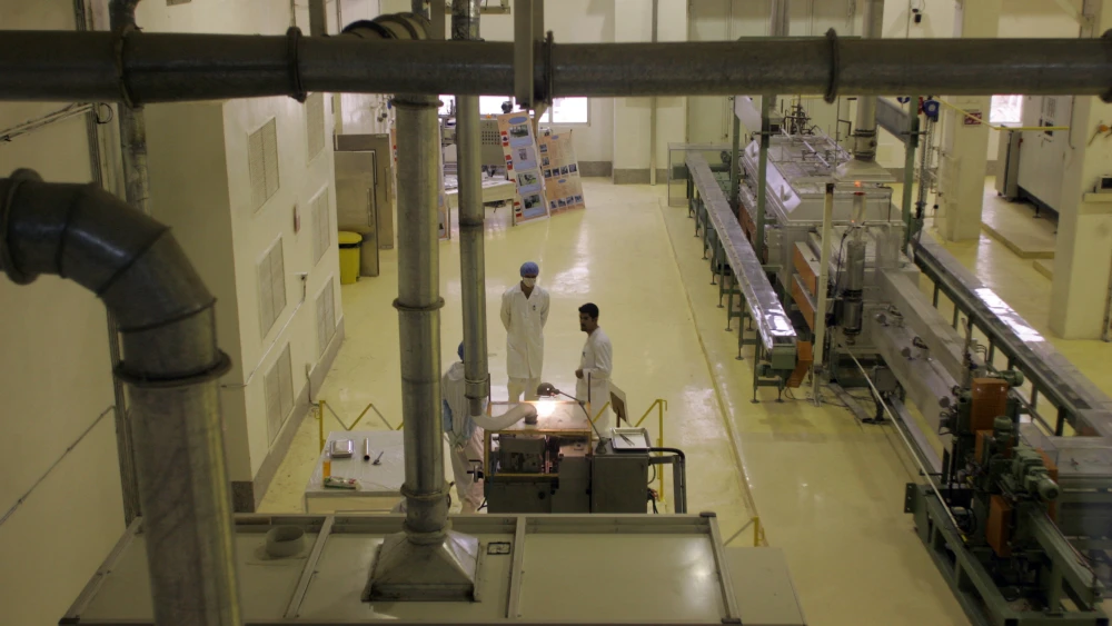 Employees work at a newly inaugurated nuclear fuel manufacturing plant in the central province of Isfahan, Iran, on April 9, 2009. Credit: Atta Kenare/AFP/Getty Images.
