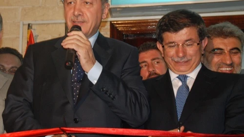 Pictured in front at a ribbon-cutting ceremony are Turkish Presdient Recep Tayyip Erdoğan (left) and Turkish Prime Minister Ahmet Davutoğlu. On May 22, 2017, Davutoğlu will resign from his post. Credit: Kahire Yunus Emre Enstitüsü via Wikimedia Commons.
