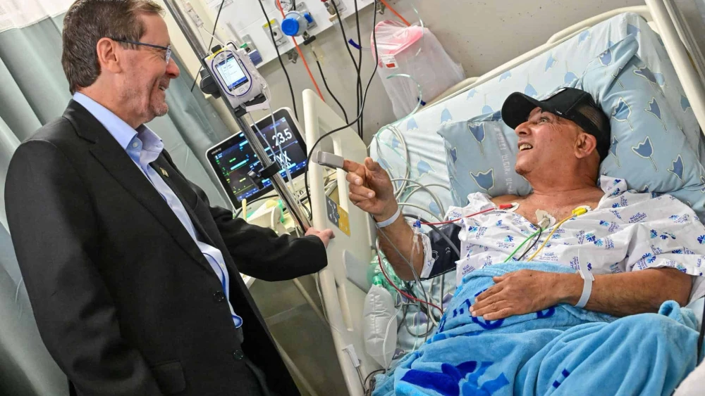 Israeli President Isaac Herzog visits a patient at Tel Aviv Sourasky Medical Center's Ichilov Hospital, March 2026. Credit: Israeli President's Residence.