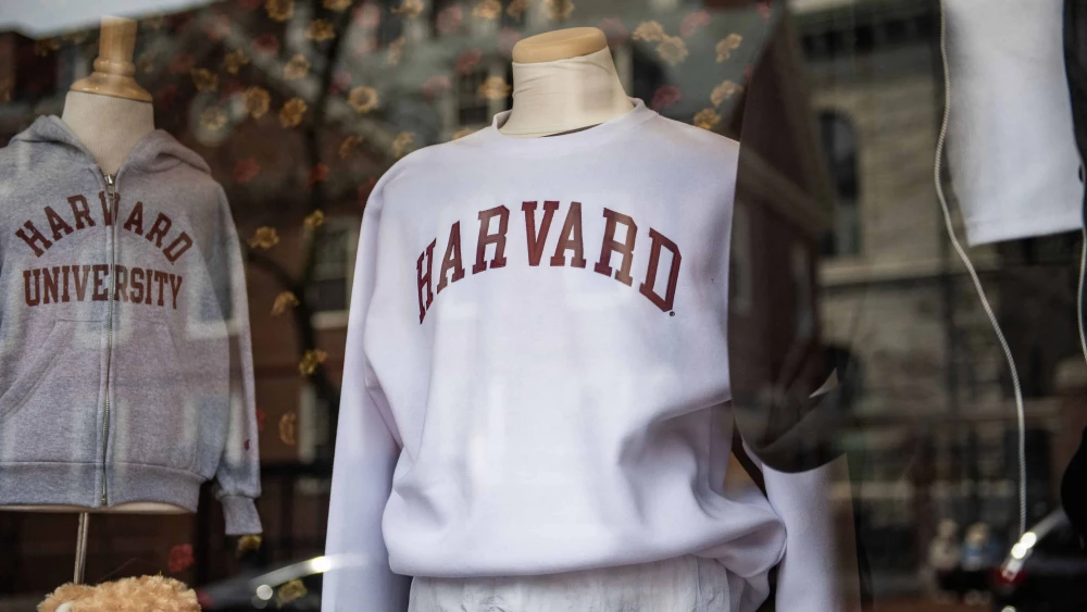 Harvard University sweatshirts are displayed for sale in a school store window on its campus in Cambridge, Mass., on April 15, 2025. Photo by Joseph Prezioso/AFP via Getty Images.