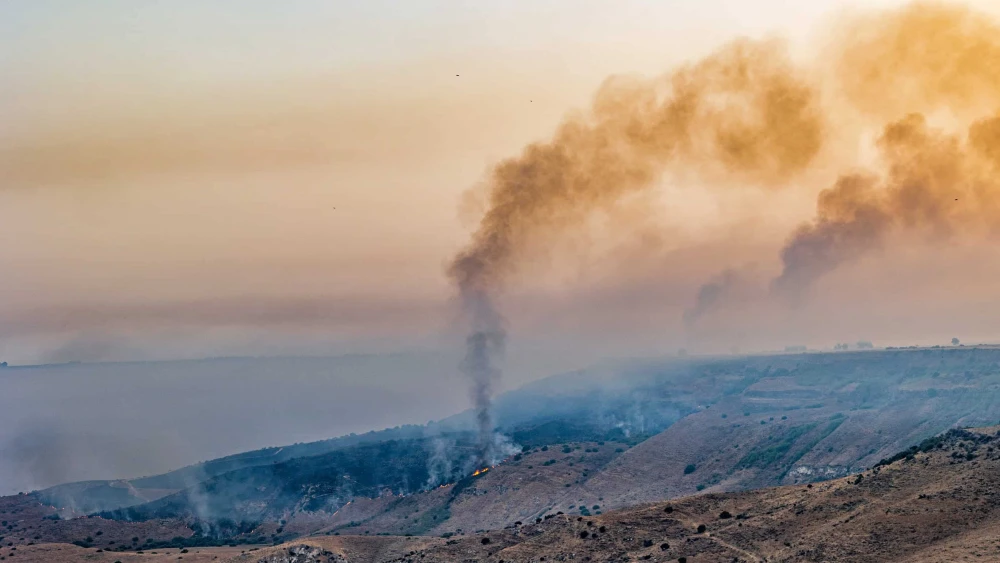 Smoke and fire rises after attacks from Lebanon at the El Al stream in the Golan Heights, July 5, 2024. Photo by Maor Kinsbursky/Flash90.