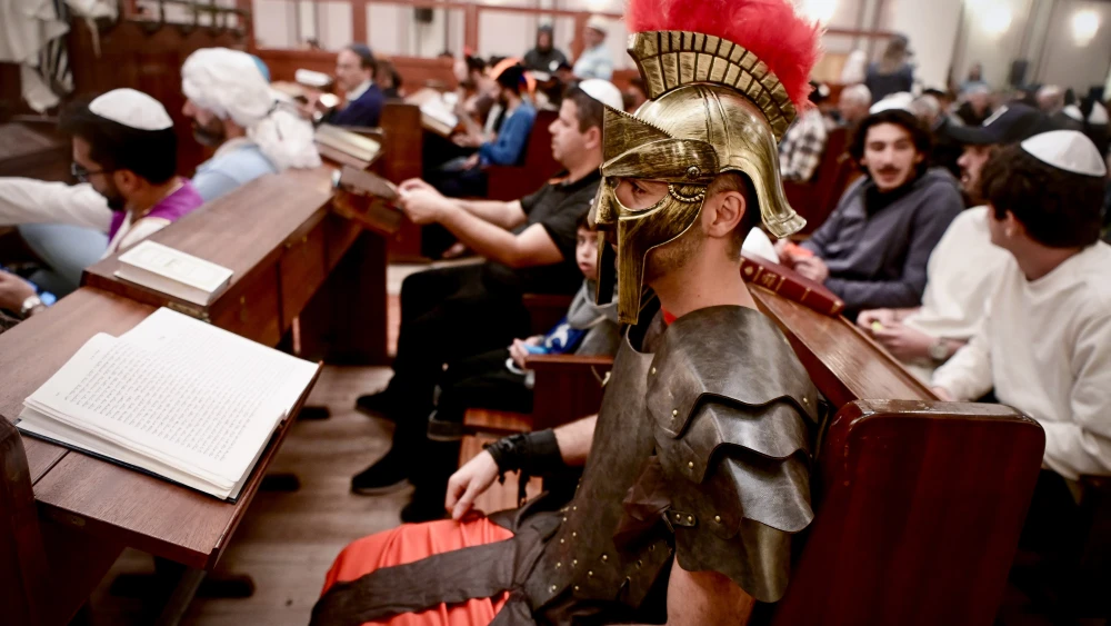Reading the Megillat Esther (the Scroll of Esther) on the eve of the Jewish holiday of Purim in the Great Synagogue of Tel Aviv on March 6, 2023. Photo by Avshalom Sassoni/Flash90.
