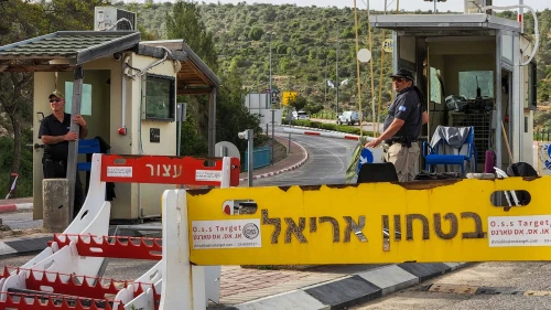 Security guards at the entrance to the city of Ariel in Samaria, April 30, 2022. Credit: Flash90.