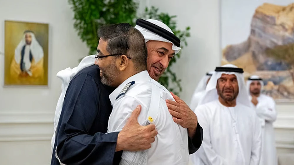 UAE President Sheikh Mohamed bin Zayed Al Nahyan embraces flydubai pilot Smit Machchhar during a reception for him and other crew members of Flight 1073 in Abu Dhabi, Oct. 27, 2026. Photo by Abdulla Al-Neyadi/UAE Presidential Court.