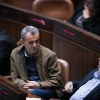 Joint Party Knesset members Jamal Zahalka (center) and Ahmad Tibi (right) attend a plenum session in the assembly hall of the Israeli parliament on Dec. 5, 2016. Photo by Yonatan Sindel/Flash90.