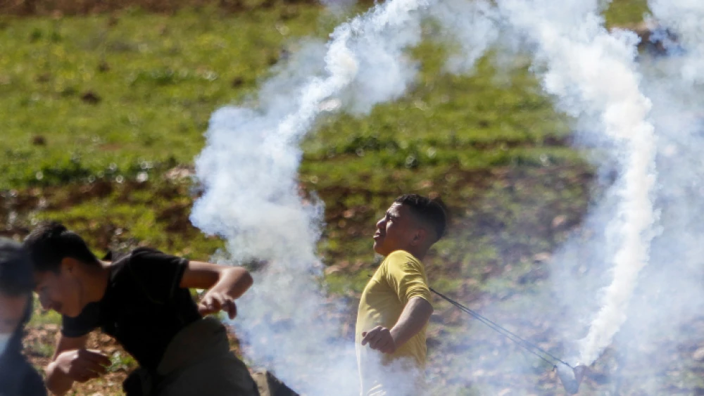 Palestinians clash with Israeli security forces during a protest in the village of Beit Dajan, near Nablus, Feb. 12, 2021 Photo by Nasser Ishtayeh/Flash90.
