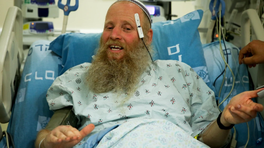 Rabbi Eitan Shnerb speaks to reporters at Hadassah Medical Center in Jerusalem's Ein Kerem, a day after being wounded in a terrorist bombing that killed his 17-year-old daughter Rina and wounded his 19-year-old son Dvir, Aug. 24, 2019. Credit: Flash90.