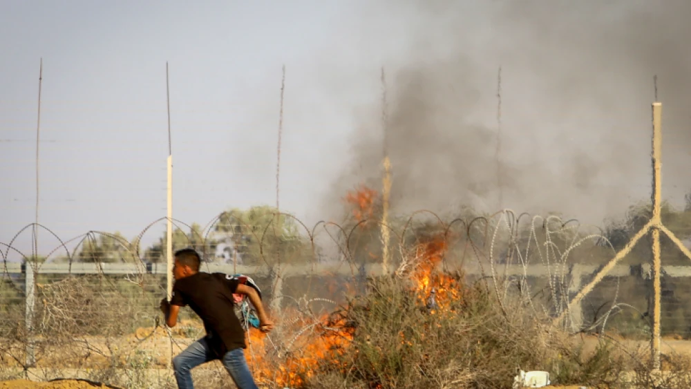 Palestinian rioters clash with Israeli security forces at the Israel-Gaza border, in the eastern part of Rafah, in the southern Gaza Strip on July 5, 2019. Photo by Abed Rahim Khatib/Flash90,