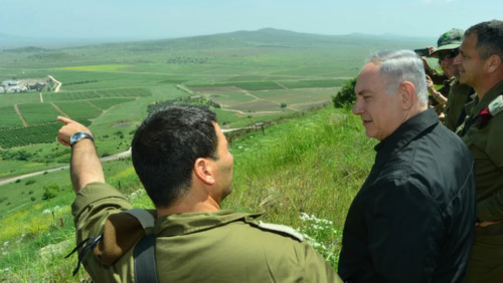 Israeli Prime Minister Benjamin Netanyahu (second from left) is pictured during a security and defense tour of the strategic Golan Heights region, near Israel’s northern border with Syria, in April 2016. Credit: Photo by Kobi Gideon/GPO.
