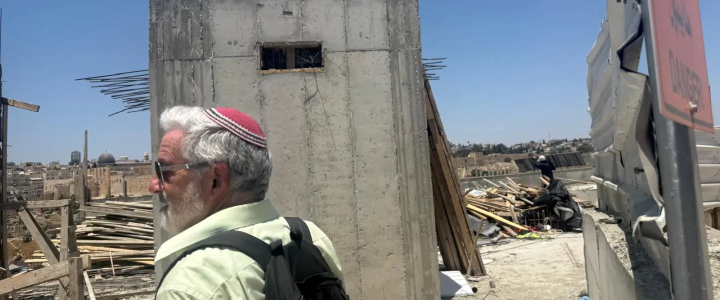 Jeff Daube, Israel chair of the International Committee for Har Hazeitim (the Mount of Olives), on the rooftop of the visitor center under construction at the Mount of Olives in Jerusalem, July 2026. Credit: Courtesy of Jeff Daube.