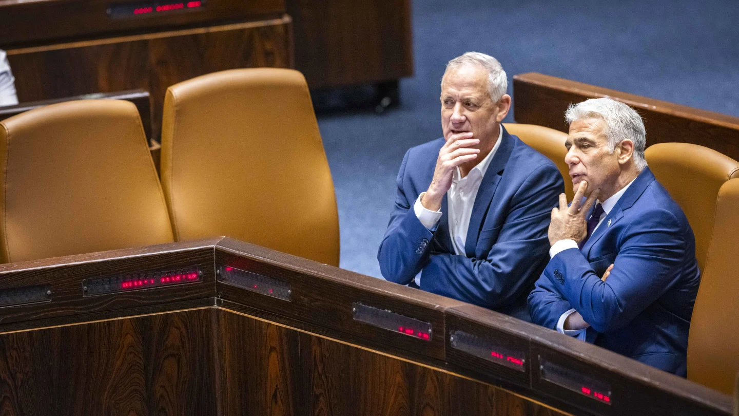 Then-Defense Minister Benny Gantz (left) and then-Prime Minister Yair Lapid in the Knesset. Photo by Olivier Fitoussi/Flash90.