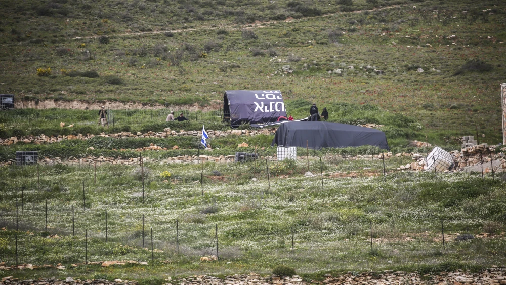 Palestinians throw stones at Jewish settlers as they establish a pastoral outpost at the site where Jewish settler Shmuel Sherman was murdered, in the village of Beit Mirin north of Nablus in Samaria. Photo by Nasser Ishtayeh/Flash90.