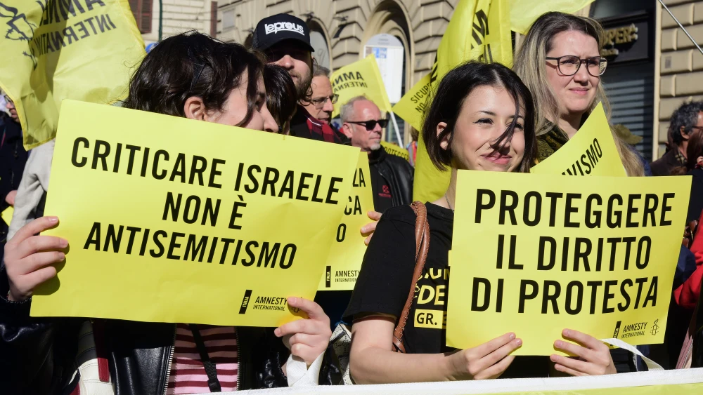 Amnesty activists hold signs against a bill to bn antisemitic rallies in Rome, Italy on March 28, 2026. Photo by Simona Granati - Corbis/Corbis via Getty Images.