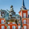 A statue in front of Plaza Mayor, the principal public square in Madrid, Spain. Credit: NextVoyage/Pixabay.