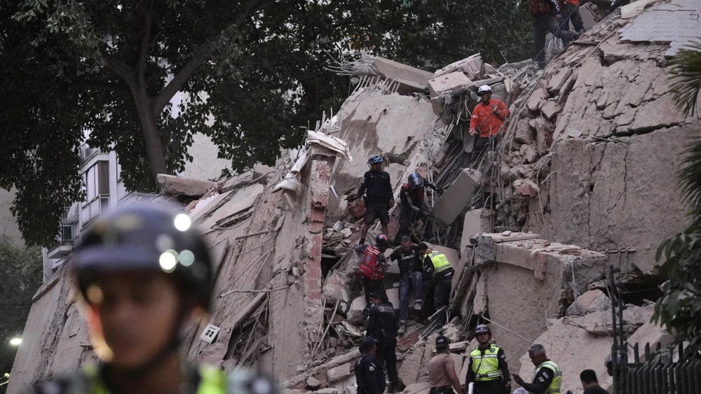 Rescue workers evacuate an injured person from a collapsed building following an earthquake in Caracas, Venezuela on June 24, 2026. Photo by Manaure Quintero / AFP via Getty Images.