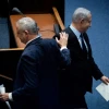 Blue and White Party leader Benny Gantz passes Israeli Prime Minister Benjamin Netanyahu at a memorial ceremony in the Knesset marking 24 years since the assassination of former Israeli Prime Minister Yitzhak Rabin, on Nov. 10, 2019. Photo by Yonatan Sindel/Flash90.
