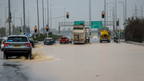 Cars drive on a flooded road at the Ad-Halom Junction following heavy rainfall near Ashdod, Jan. 9, 2020. Credit: Flash90.
