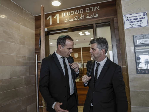 Lawyers gather outside the court hearing of Bezalel Zini, who is suspected of smuggling cigarettes into the Gaza Strip, at the Ashkelon Magistrate’s Court, Feb. 3, 2026. Photo by Tsafrir Abayov/Flash90.