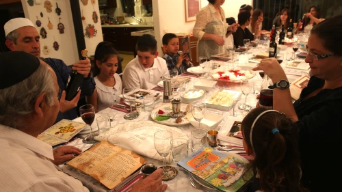 An Israeli family seen during the "Passover Seder" on the first night of the 8-day long Jewish holiday of Passover, in Tzur Hadassah. March 25, 2013 Credit: Nati Shohat/flash 90.