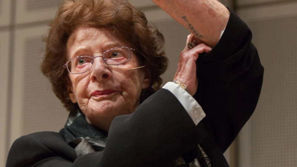 Holocaust survivor Agi Geva shows her number tattoo from Auschwitz. Credit: U.S. Holocaust Memorial Museum.