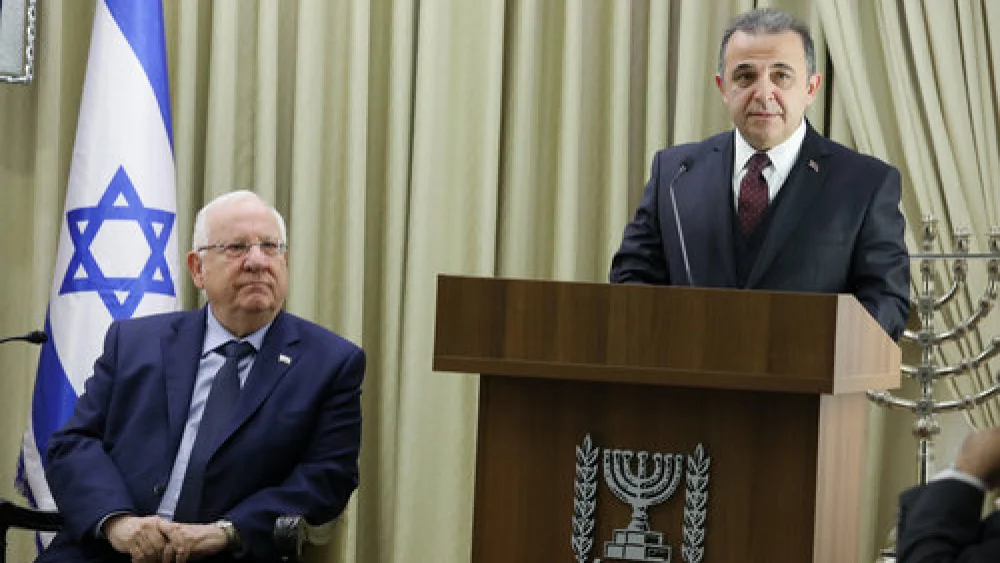Israeli President Reuven Rivlin (left) looks on as incoming Turkish Ambassador to Israel Kemal Okem speaks during a ceremony for new ambassadors at the President's Residence in Jerusalem Dec. 12, 2016. Credit: Isaac Harari/Flash90.