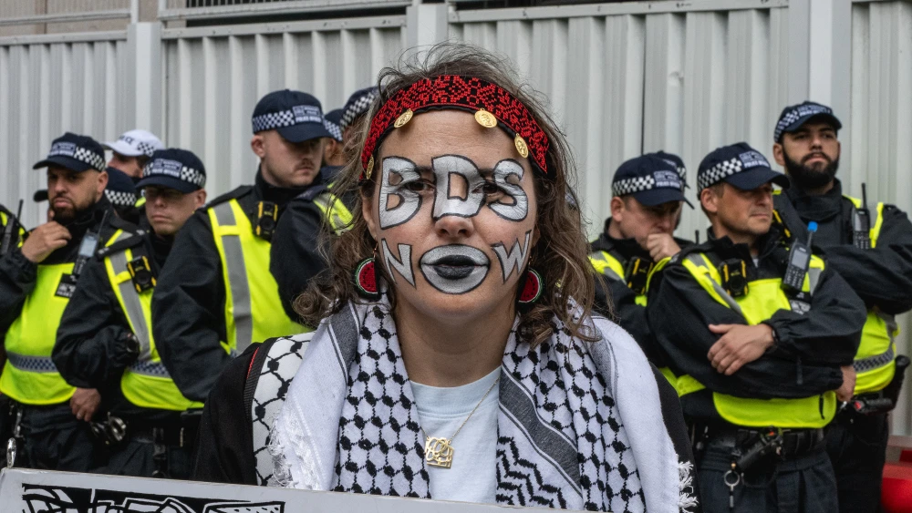 A woman with her face painted demanding sanctions against Israel during the National Demonstration for Gaza in London, on June 8, 2024. Photo by Guy Smallman/Getty Images.