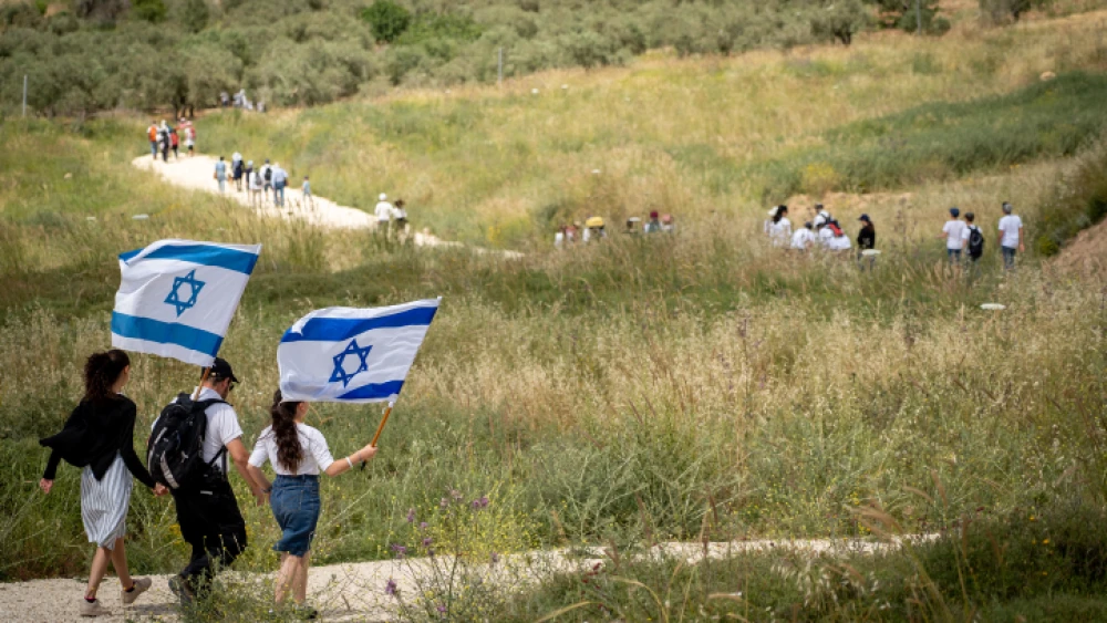 Israelis participate in a march to celebrate Israel's 71st Independence Day near Havat Gilad in Judea and Samaria on May 9, 2019. Photo by Hillel Maeir/Flash90.