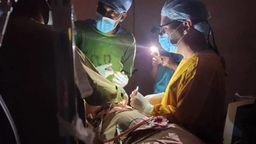 Israeli and Ethiopian doctors operating on a three-year-old child during a power failure at the St. Peter’s Hospital in Addis Ababa, Ethiopia. Photo by Dr. Vasile Recea via TPS.