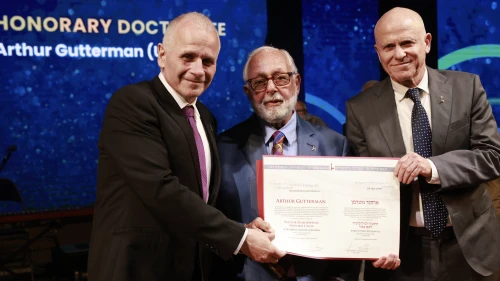 The Hebrew University of Jerusalem President Professor Asher Cohen (left) presented humanitarian, philanthropist, and businessman Arthur Gutterman with a prestigious Honorary Doctorate degree during the 86th Board of Governors Meeting on June 12, 2023, in Jerusalem. Professor Tamir Sheafer, Hebrew University Rector, is on his right. Credit: Yossi Zamir.