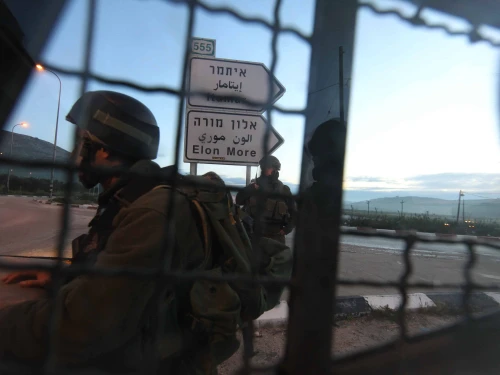 Israeli soldiers block a road near Huwara, south of the Samaria city of Nablus (Shechem), March 12, 2011. Photo by Nati Shohat/Flash90.