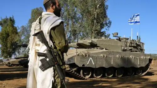An Israeli soldier recites morning prayers near the border with Lebanon, Oct. 25, 2023. Photo by Michael Giladi/Flash90.