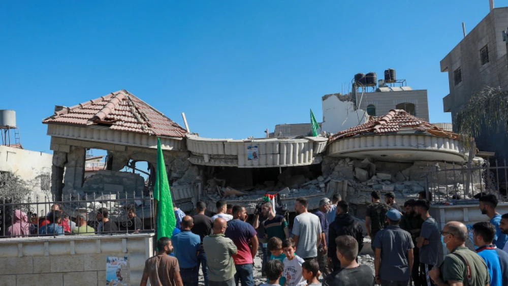 Palestinians stand near the ruins of the house of accused terrorist Muntasir Shalabi in the village of Turmus Aya, northeast of Ramallah, after it was demolished by the Israeli army, July 8, 2021. Photo by Flash90.
