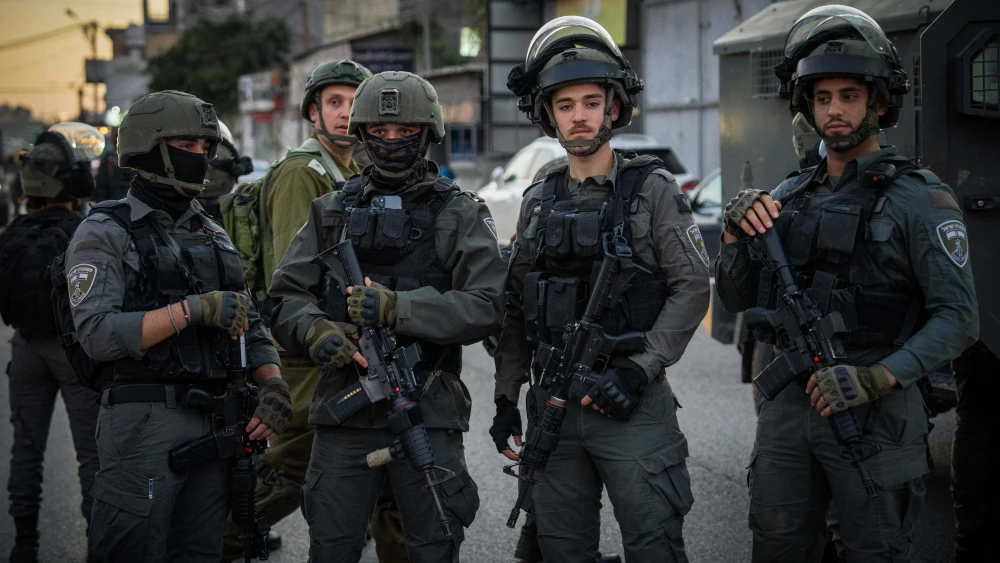 Israeli security forces guard the scene where three Israelis were murdered in the village of al-Funduq in Samaria, Jan. 6, 2025. Photo by Erik Marmor/Flash90.