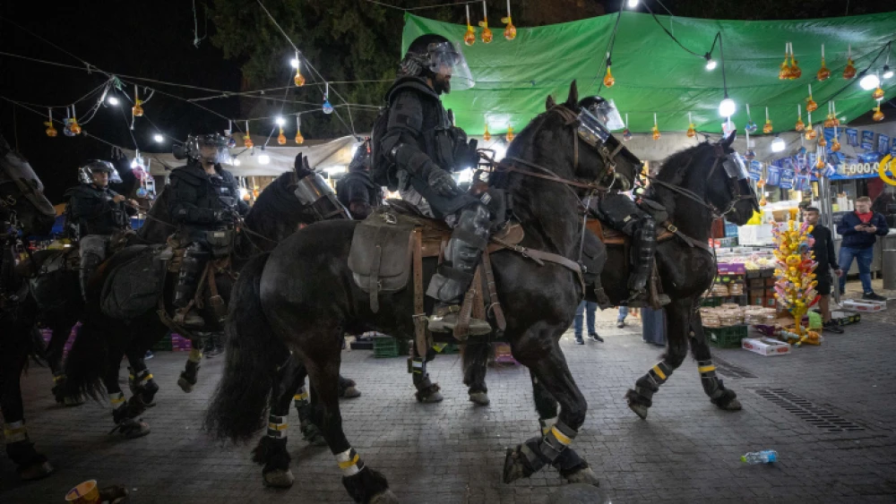 Israel police officers clash with Arabs outside the Damascus Gate in Jerusalem's Old City during anti-Jewish protests on April 24, 2021. Photo by Yonatan Sindel/Flash90.