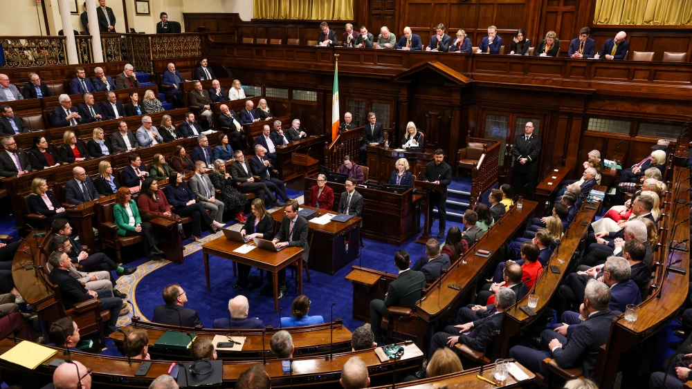 Ukraine's President Volodymyr Zelensky in the Dáil Chamber delivering a special speech in a joint sitting of Ireland's two Houses of Parliament in Leinster House, Dublin, December 2, 2025. Photo by Tony Maxwell/Pool/AFP via Getty Images)