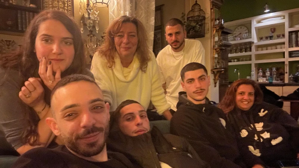 Esther Voet, center of upper row, with Israelis who took refuge in her apartment in Amsterdam, the Netherlands on Nov. 7, 2024. Photo by Bart Schut.