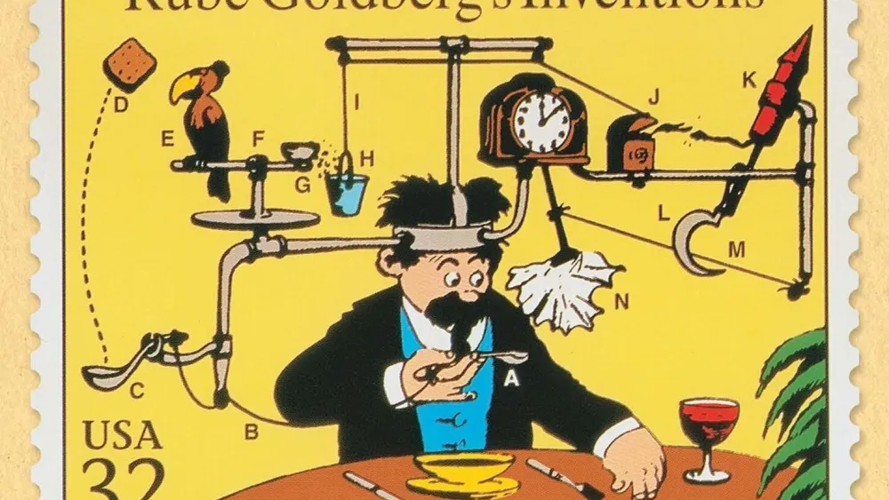 A USPS stamp honoring Rube Goldberg. Credit: Rubegoldberg.com