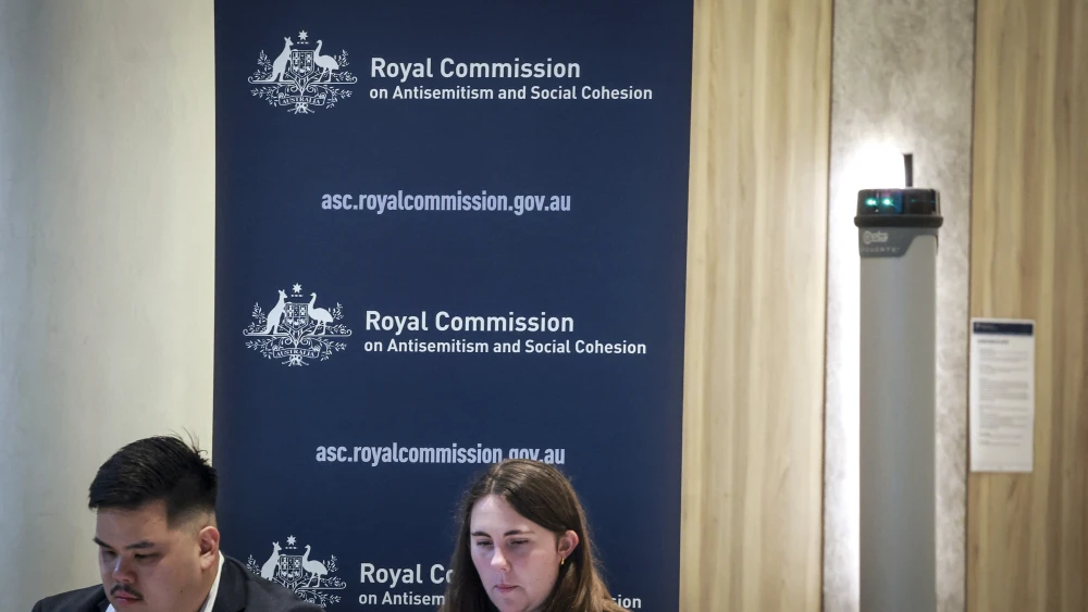 Officials can be seen outside the venue of the Royal Commission on Antisemitism and Social Cohesion in Sydney on May 25, 2026. Photo by David Gray / AFP via Getty Images.