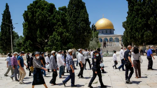 Israeli security forces escort a group of religious Jews as they visit the Temple Mount in Jerusalem's Old City, after it was reopened to the public, May 31, 2020. Photo by Sliman Khader/Flash90.